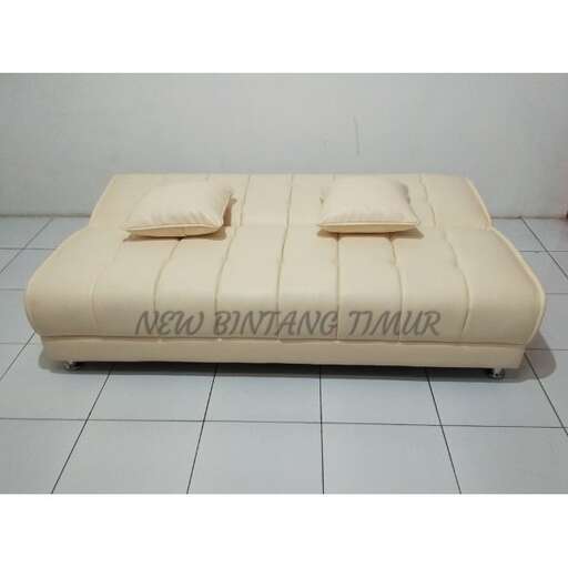 a mattress sitting on a tiled floor in a room.