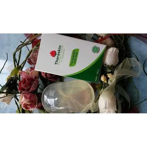 a bouquet of flowers and a bottle of water.