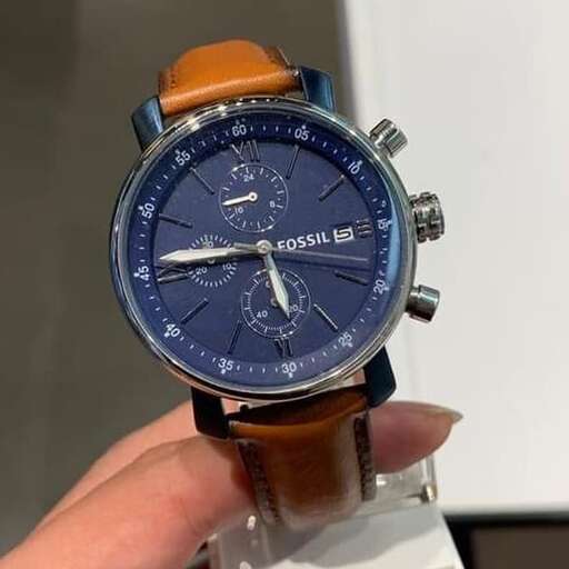 a watch with a blue dial and a brown leather strap.