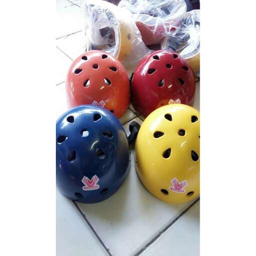 three helmets with a face mask on top of them.