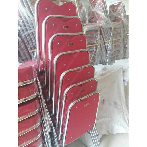 a stack of red and white chairs stacked up.