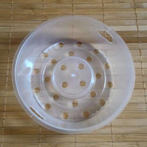 a plastic bowl with holes in it.