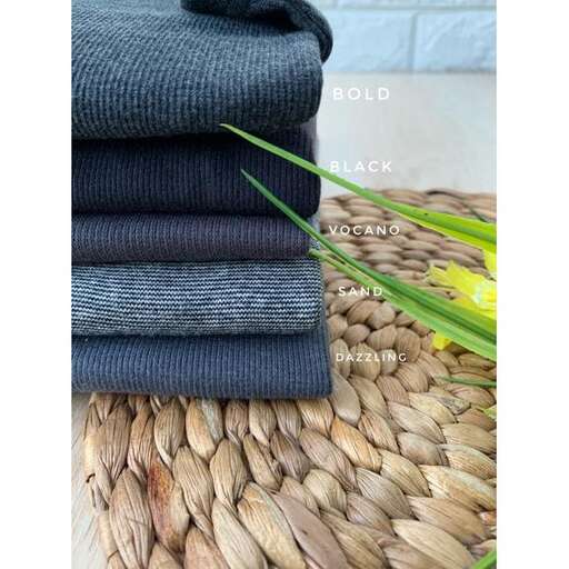 a stack of warm woolen sweaters