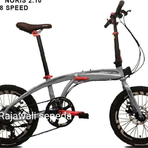 a bicycle with a red seat