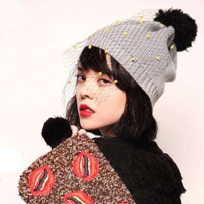 knitted hat with black and white face. knitted by me.