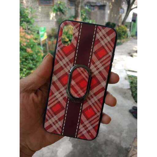 a person holding a cell phone in their hand.