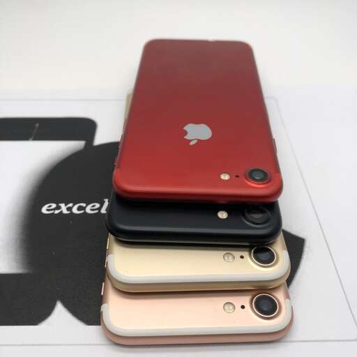 a group of cell phones sitting on top of a table.