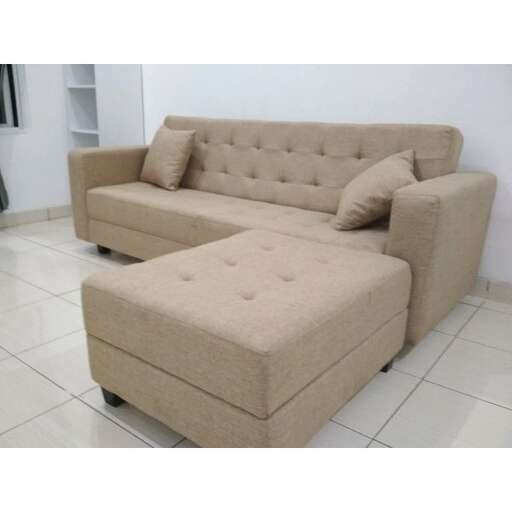 a large couch with a cushioned seat and a cushion.