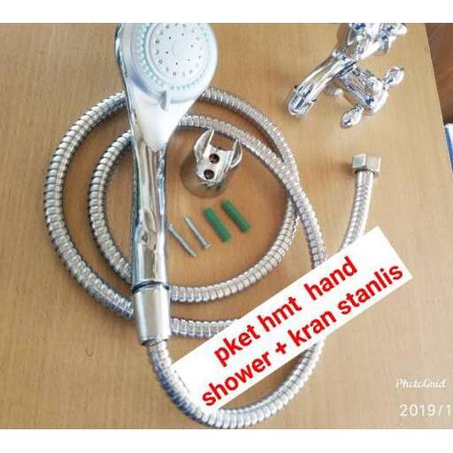 a hand is holding a hose and a hose.