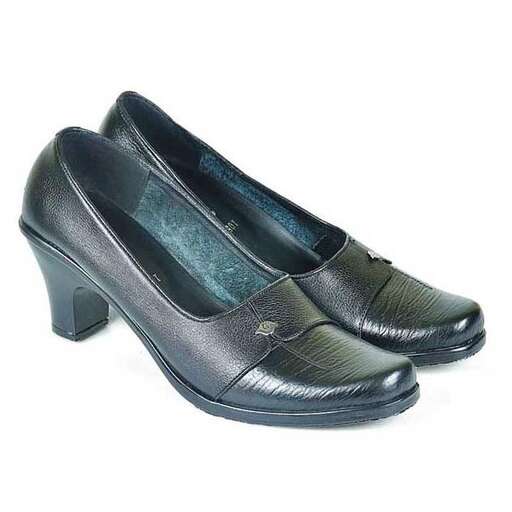 a pair of black shoes with a design on the sole.