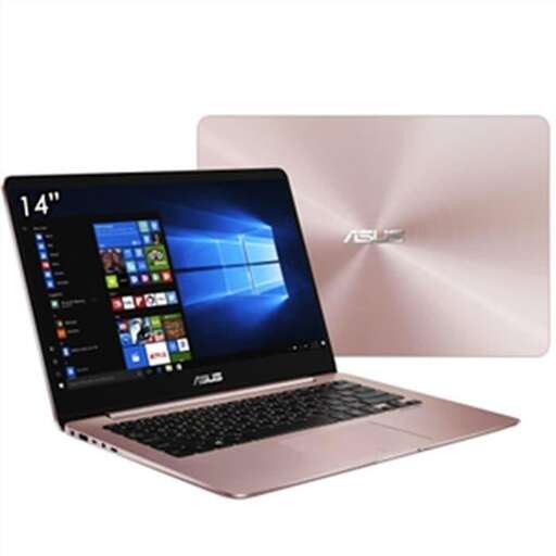 a laptop computer sitting on top of a white box.