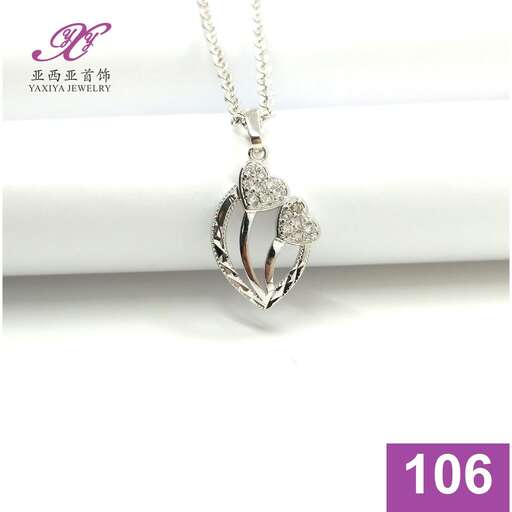 a pendant in sterling silver with a diamond.