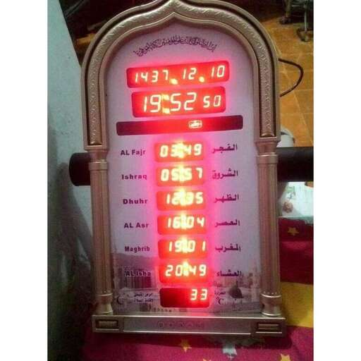 a clock with a digital clock showing the time