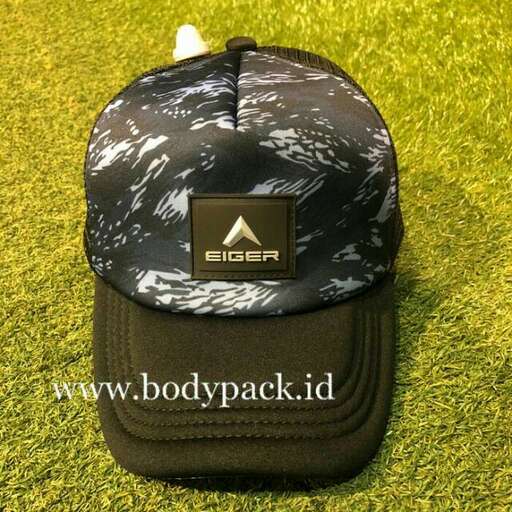 a black and white hat with a black logo on it.