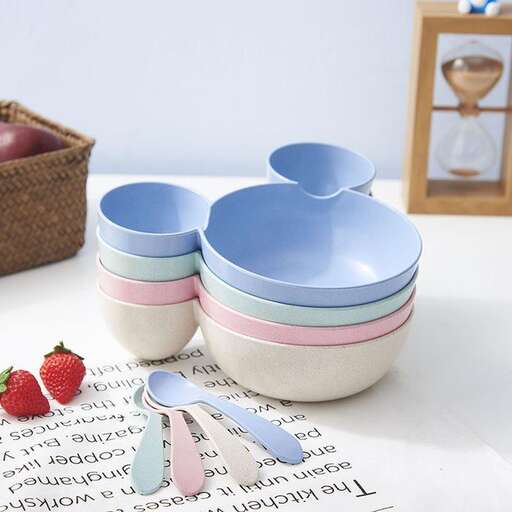 a collection of colorful bowls and spoons.