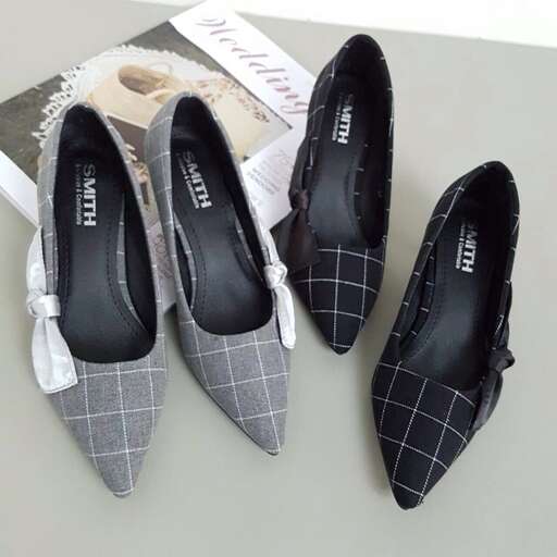 a pair of shoes with a checkered pattern.