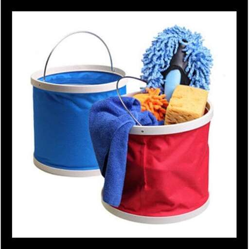 a red and blue bucket with a blue towel and a blue blanket.