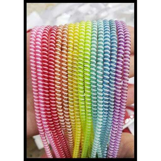 rainbow colored hair clip in a black frame.