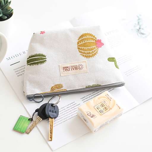 a purse with a keychain and keys on it.