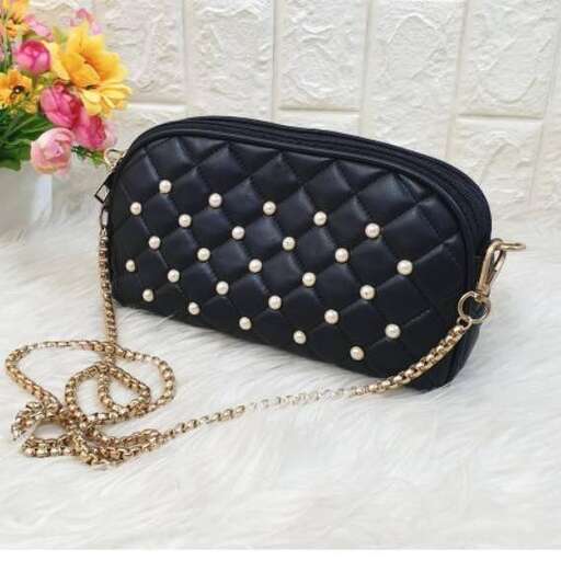black leather bag with a gold chain