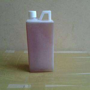 a pink plastic bottle with a white lid