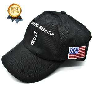 baseball cap in black with white stripes and a flag