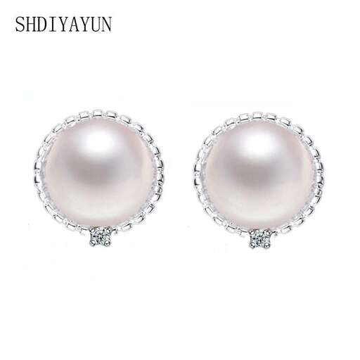 a pair of pearl and diamond earrings