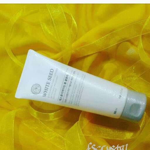 a tube of shampoo on a yellow cloth.