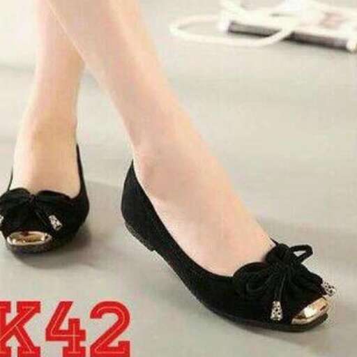 a woman's shoe with a black bow.