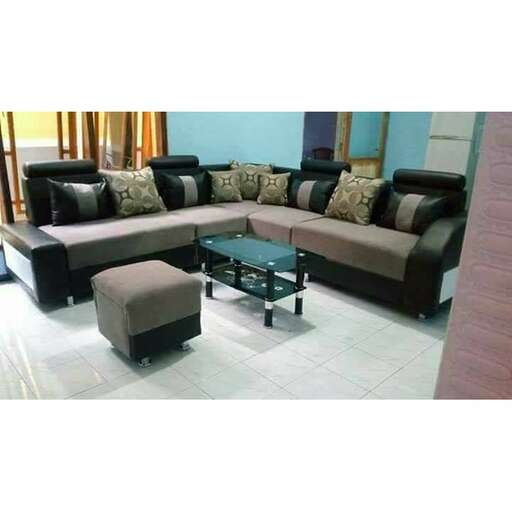 a living room with a couch, coffee table, and a coffee table.