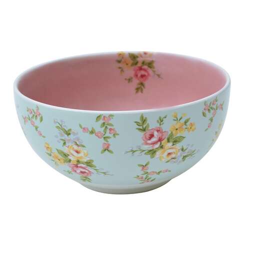 pink and white bowl with flowers on the inside