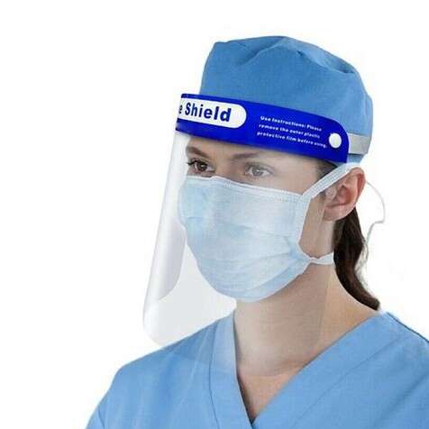 a person in a surgical uniform wearing a surgical mask.