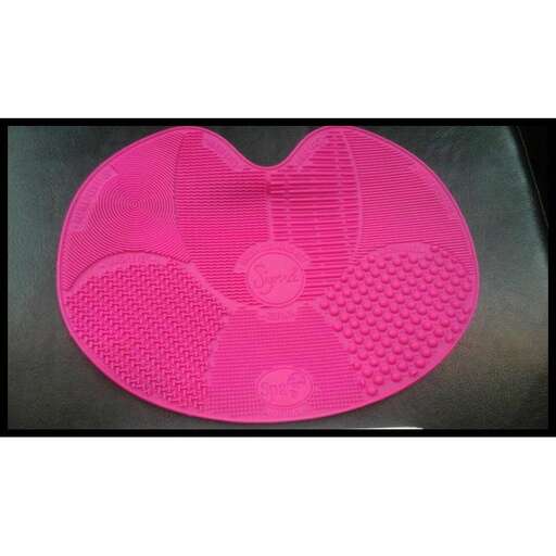 a pink shoe in the shape of a heart