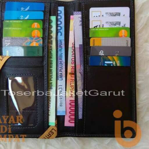 a small wallet with a few items inside