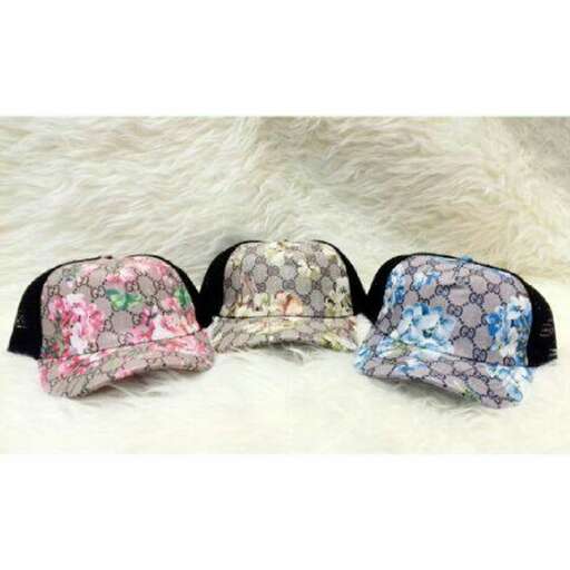 a pair of hats with floral print on them.