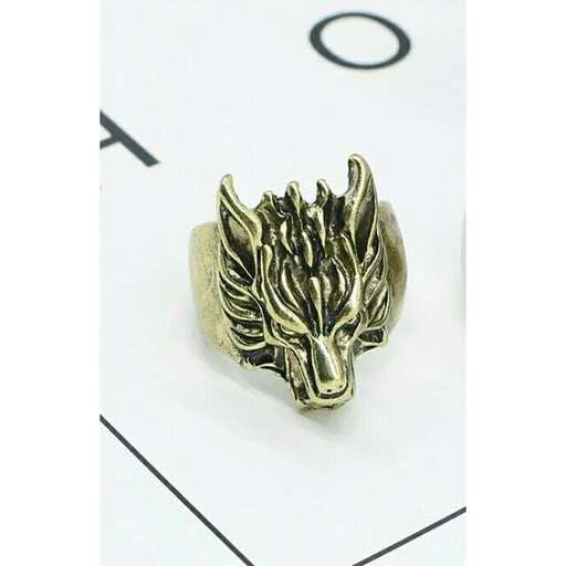 a gold ring with a flame inside
