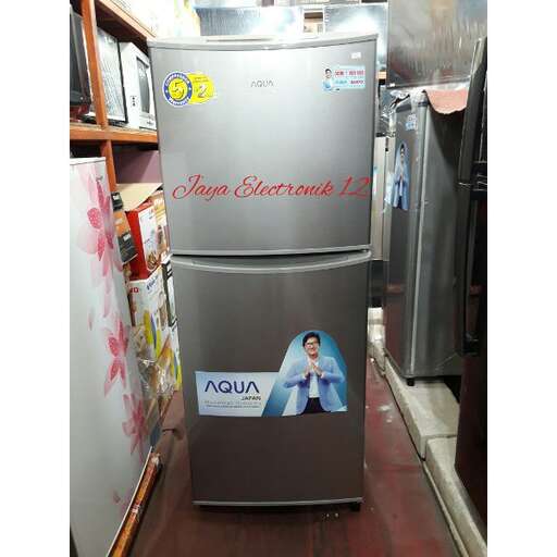 a stainless steel refrigerator with a picture of a woman on it.