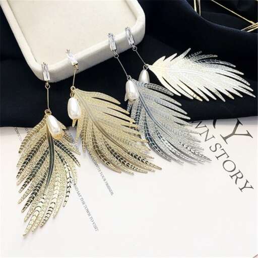 earrings made of silver and gold with a feathered design.