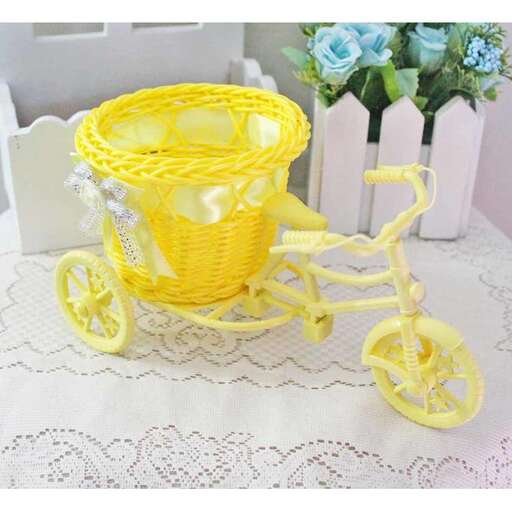 yellow bicycle with a basket