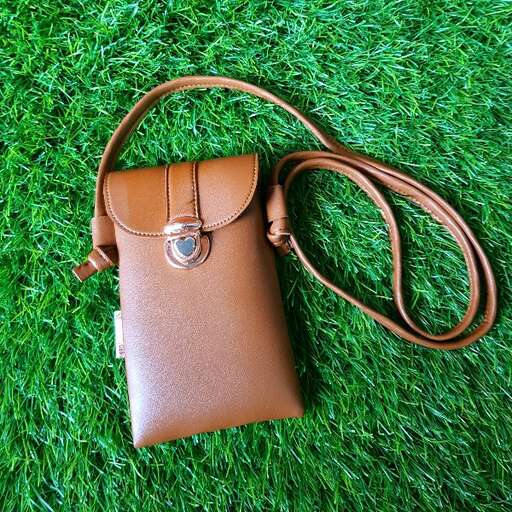 leather bag in the grass