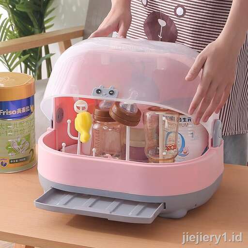 a person holding a toy box with a toy inside.