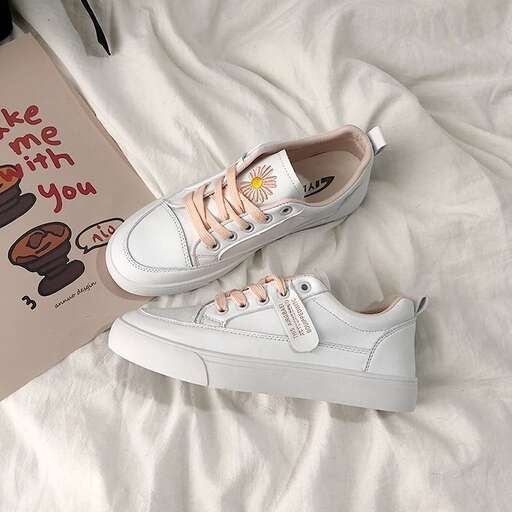 a pair of white sneakers with pink and orange stripes.