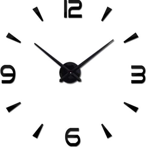a white wall clock with black hands