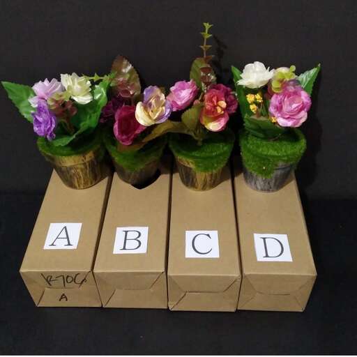 three boxes with flowers on them with letters written on them.