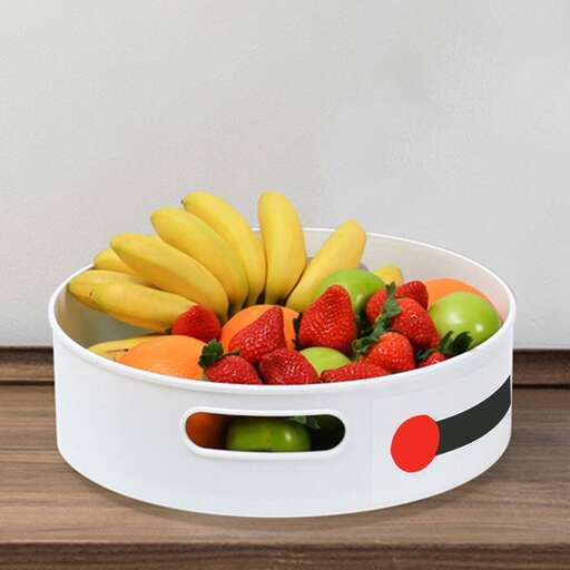 a bowl of fruit sitting on a table.
