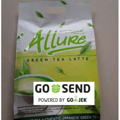 a bag of green tea with a green drink in it.