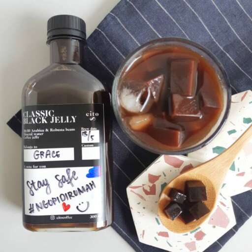 a bottle of soy sauce and a spoon.
