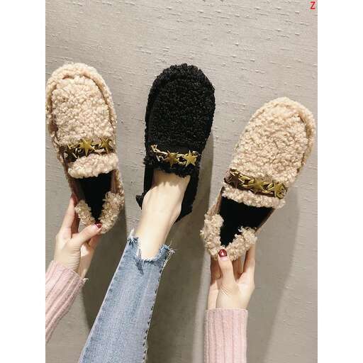 a pair of black and brown slippers.