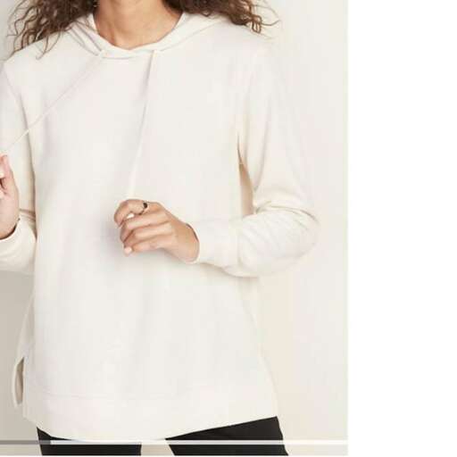 a white sweater with a long sleeve