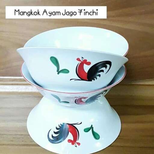 a bowl with a bird on it